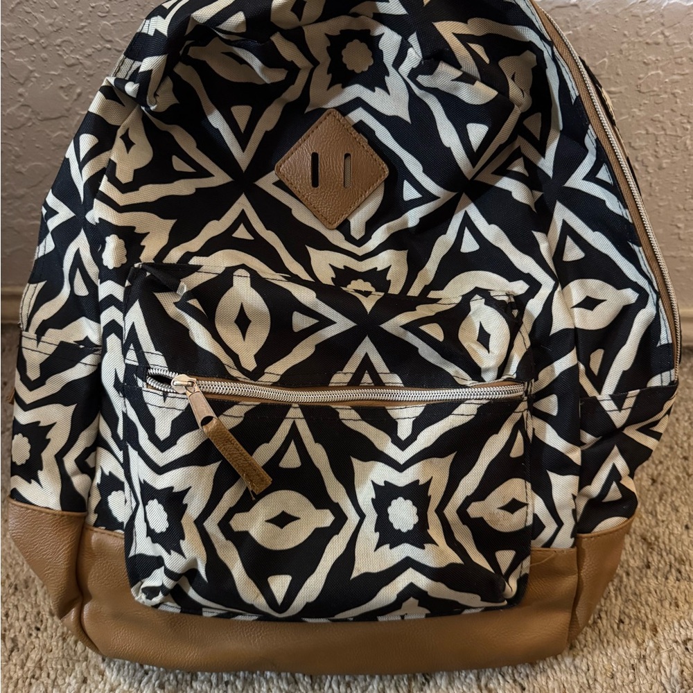 Black and White Patterned Backpack with Tan Accents